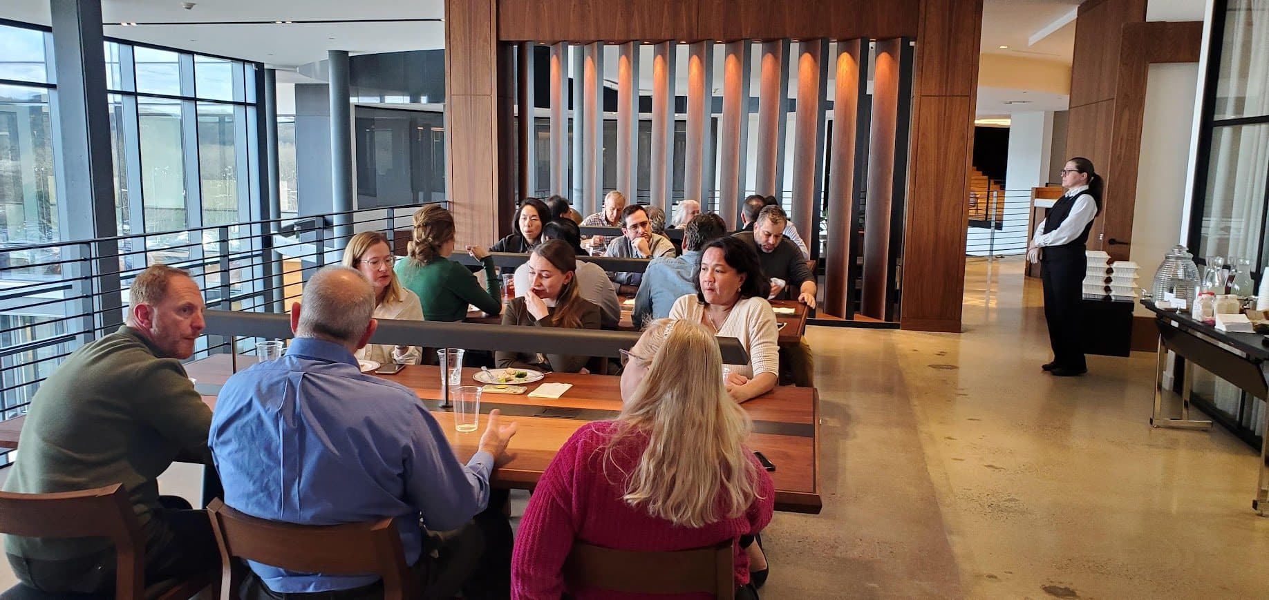 Team gathered during a daytime corporate meeting