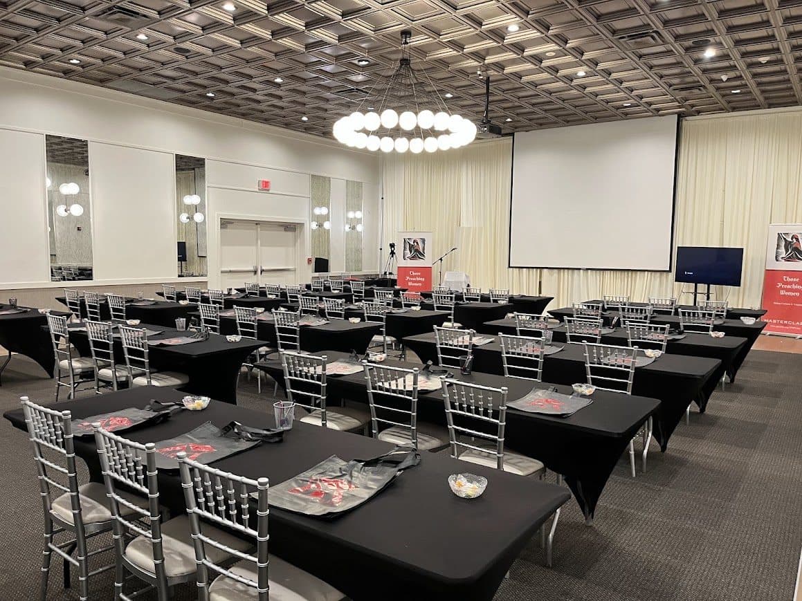 Meeting room set for a corporate program with projection and classroom seating